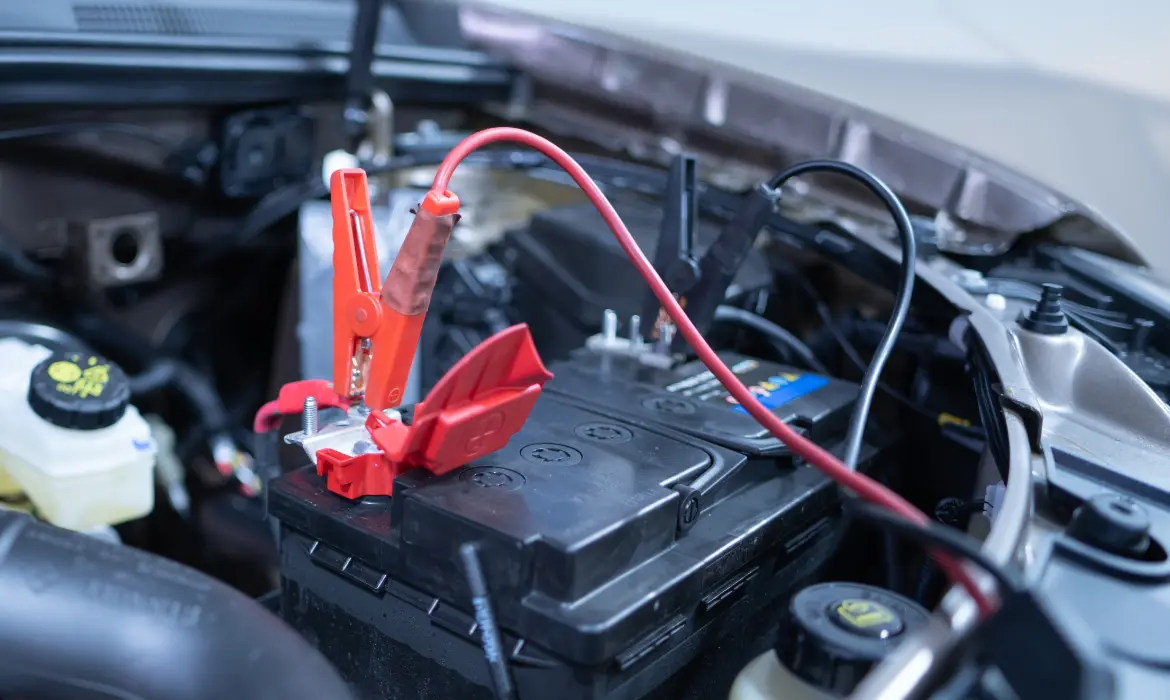 Jumper cables attached to a car battery