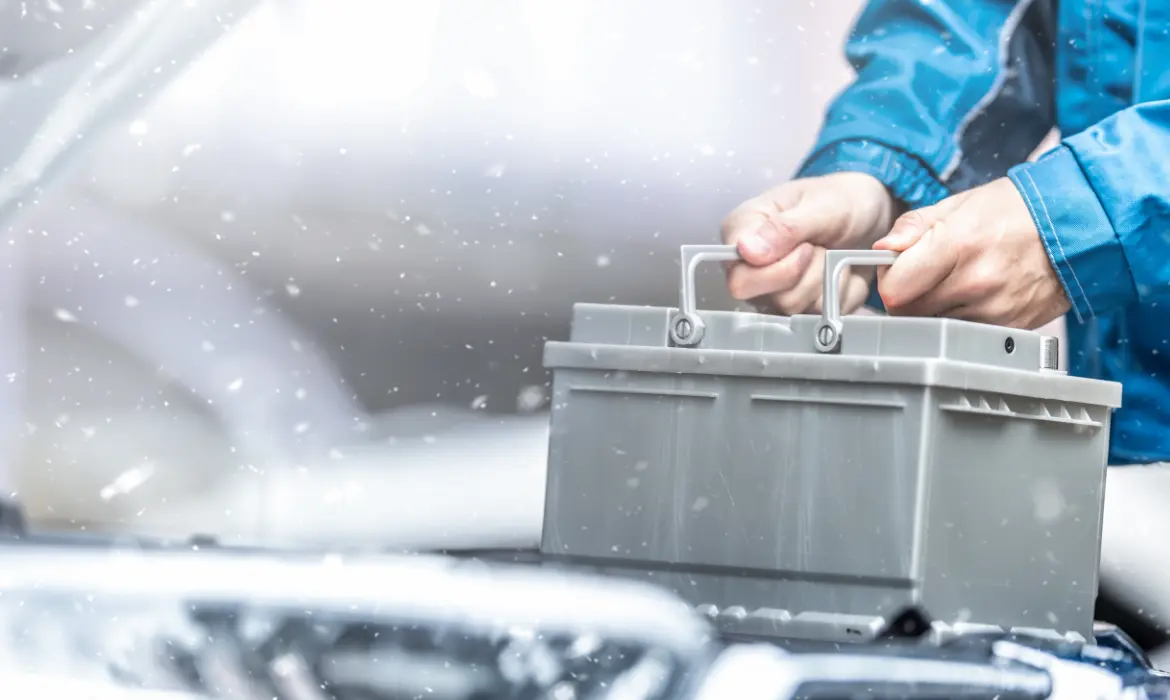 A man replacing a car battery