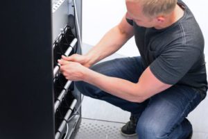 Man maintaining a battery